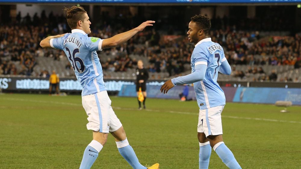 Manchester City's Raheem Sterling celebrates scoring their first goal with Bruno Zuculini