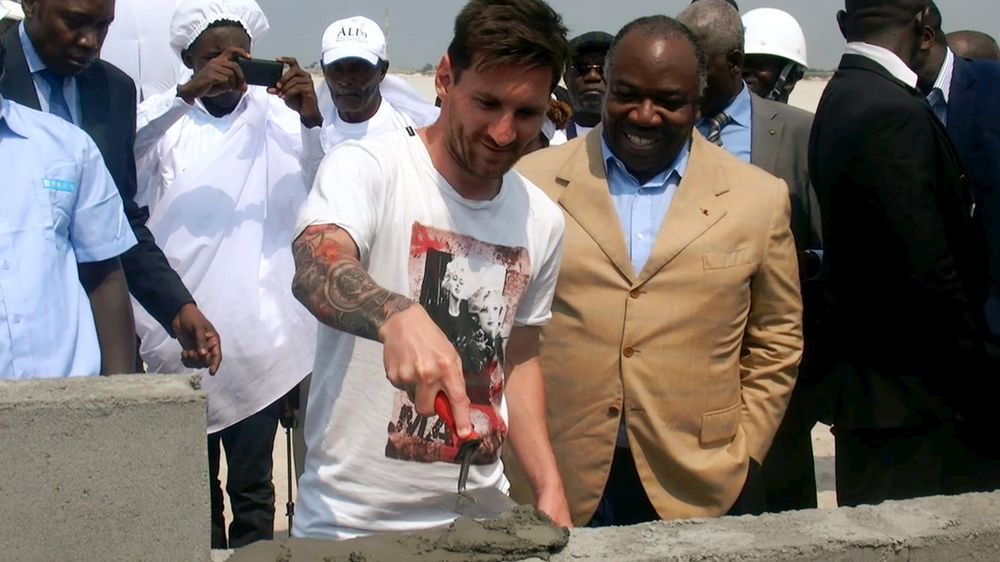 Lionel Messi lays the first stone at the construction site of a new stadium in Port-Gentil
