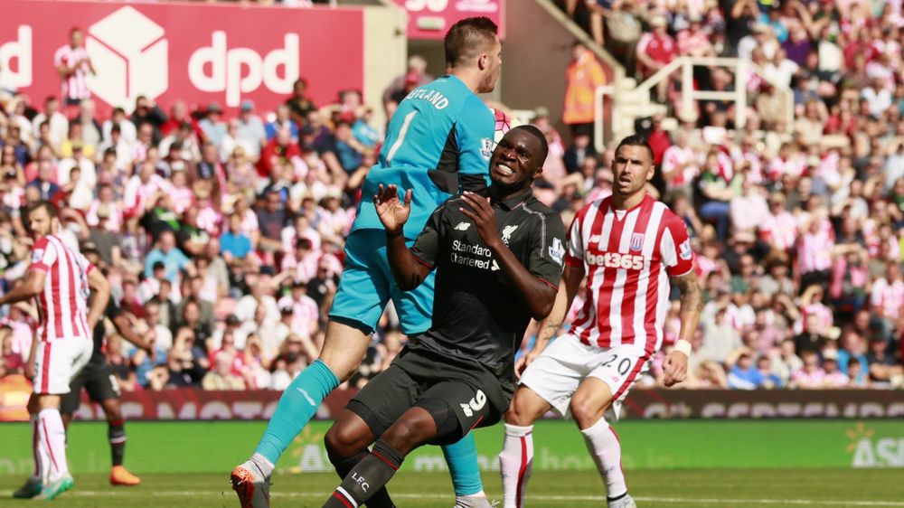 Liverpool's Christian Benteke reacts as Stoke's Jack Butland claims the ball. Action Images via Reuters / Jason Cairnduff
