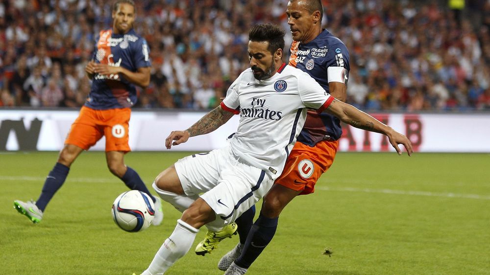 Montpellier's Hilton (R) challenges Paris St Germain's Ezequiel Lavezzi