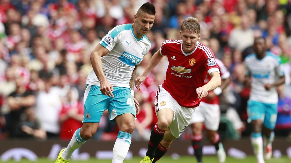 Manchester United's Bastian Schweinsteiger in action with Newcastle United's Aleksandar Mitrovic