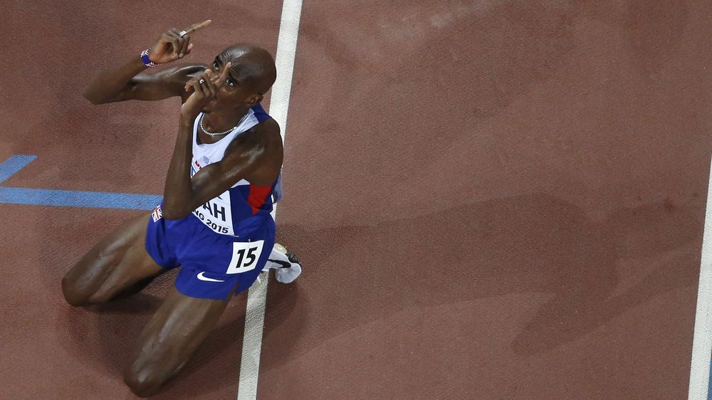 Mo Farah of Britain gestures after winning the men's 5000 metres final at the 15th IAAF Championships at the National Stadium in Beijing, China August 29, 2015.