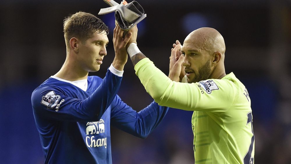 Everton's John Stones celebrates with Tim Howard after the game