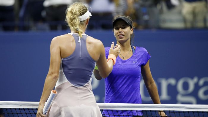 Petra Cetkovska of the Czech Republic (R) shakes hands with Caroline Wozniacki of Denmark (L)