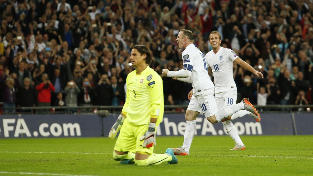 Wayne Rooney celebrates after scoring the second goal for England from the penalty spot and becoming England's all time leading goalscorer