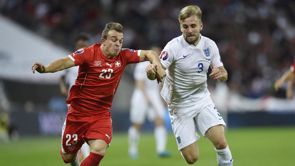England's Luke Shaw in action with Switzerland's Xherdan Shaqiri