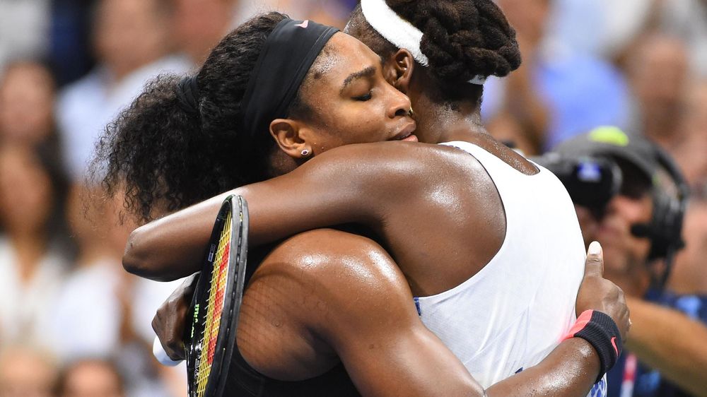 Serena Williams of the USA (left) hugs sister Venus Williams of the USA after their match on day nine of the 2015 U.S. Open tennis tournament at USTA Billie Jean King National Tennis Center