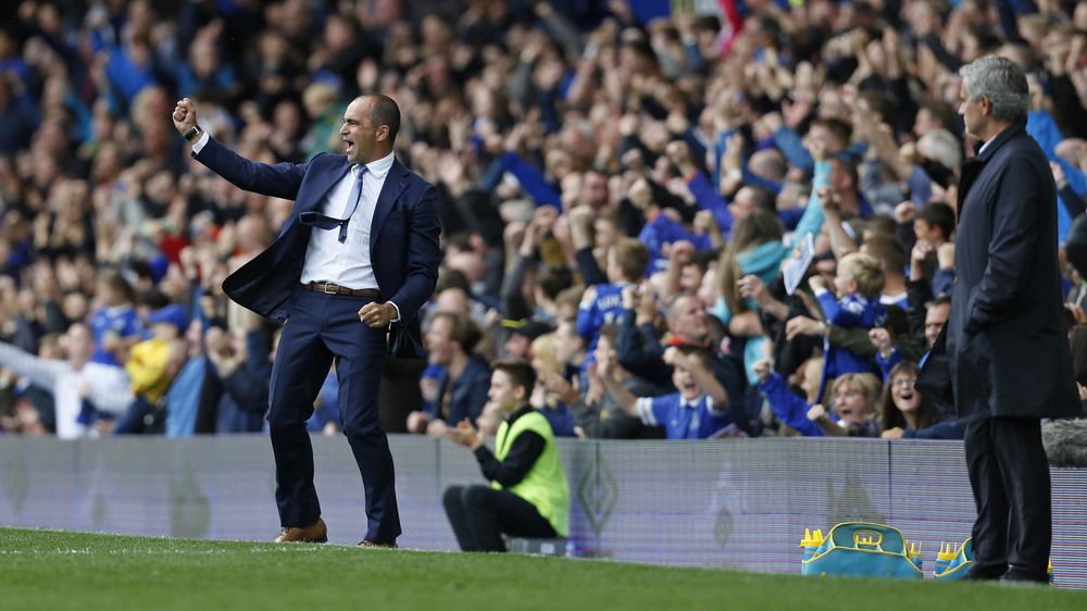 Jose Mourinho looks on as Roberto Martinez celebrates a goal