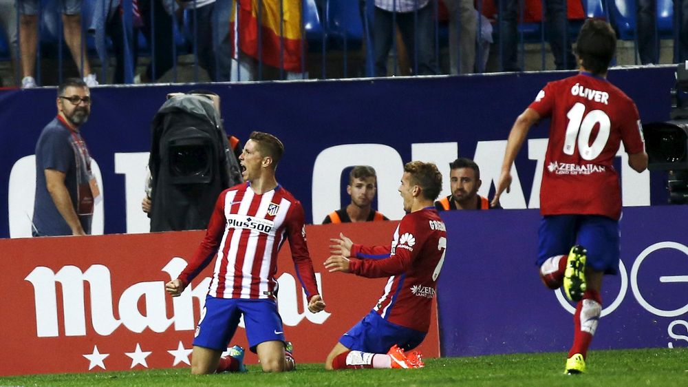 Fernando Torres celebrates opening the scoring for Atletico Madrid