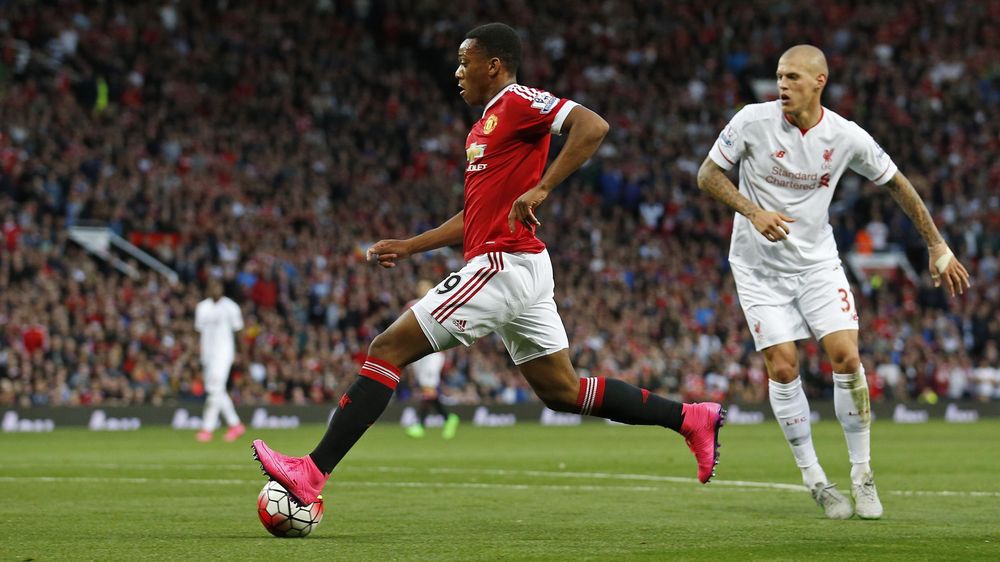 Anthony Martial shoots and scores against Liverpool