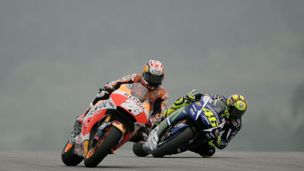 Movistar Yamaha MotoGP's Italian rider Valentino Rossi (R) and Repsol Honda Team's Spanish rider Dani Pedrosa (L) power their bikes during the third practice session of the MotoGP Malaysian Grand Prix at Sepang International Circuit on October 24, 2015