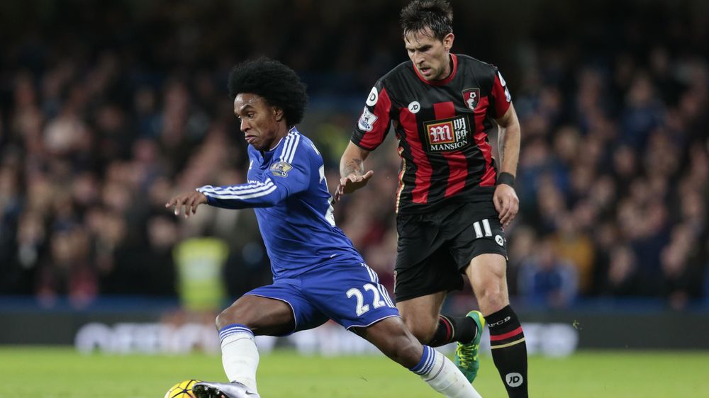 Bournemouth's Charlie Daniels and Chelsea's Willian in action