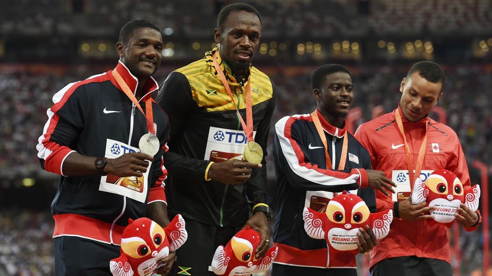 Silver medallist USA's Justin Gatlin, gold medallist Jamaica's Usain Bolt, bronze medallists USA's Trayvon Bromell and Canada's Andre De Grasse pose with their medals on the podium during the victory ceremony for the men's 100 metres athletics event at t