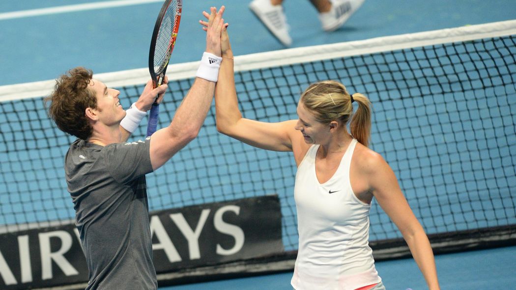 Andy Murray (L) celebrates a point with Maria Sharapova