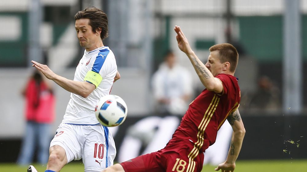 Russia's Oleg Ivanov and Czech Republic's Tomas Rosicky in action