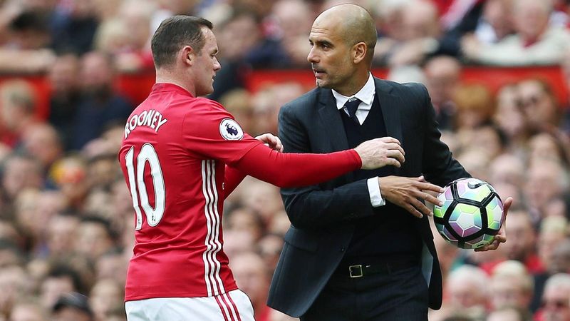 Wayne Rooney and Pep Guardiola fights for the ball