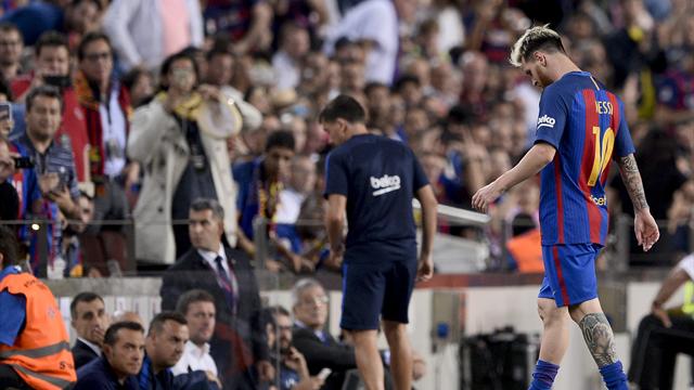 Messi limps off as Barcelona and Atletico Madrid play out draw