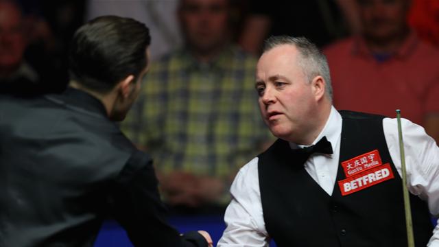 Mark Selby fights back but John Higgins still leads overnight