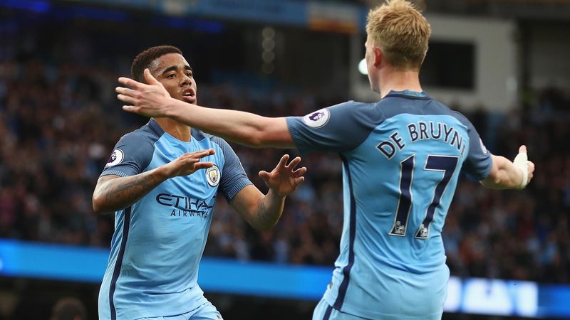 Gabriel Jesus of Manchester City celebrates scoring his sides first goal with Kevin De Bruyne of Manchester City during the Premier League match between Manchester City and West Bromwich Albion at Etihad Stadium on May 16, 2017 in Manchester, England.