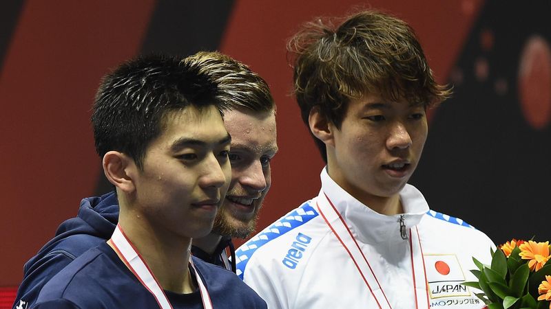 TOKYO, JAPAN - MAY 19: (L-R) Zibei Yan of China, Adam Peaty of Great Britain and Ippei Watanabe of Japan pose on the podium with their medals after the 100m Breaststroke Final during the Japan Open 2017 at Tokyo Tatsumi International Swimming Pool on May