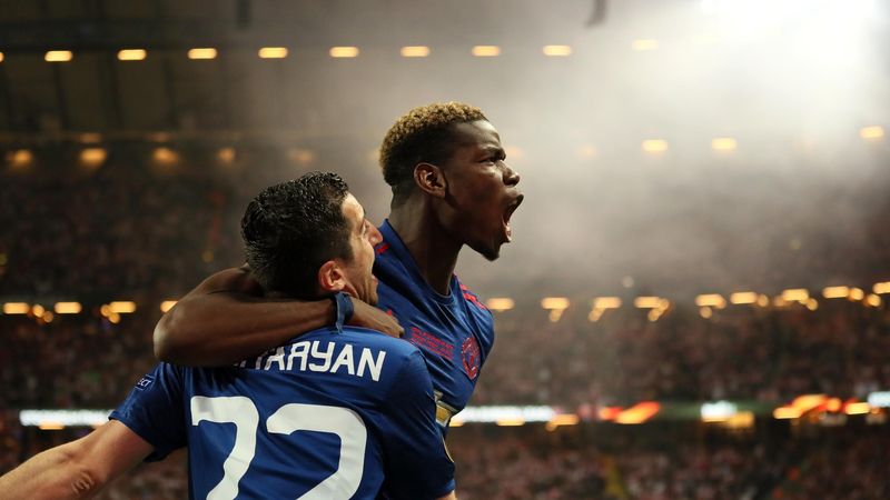 Henrikh Mkhitaryan of Manchester United celebrates scoring the second goal to make the score 0-2 with team-mate Paul Pogba during the UEFA Europa League Final between Ajax and Manchester United at Friends Arena on May 24, 2017 in Stockholm, Sweden.