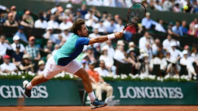 Rain lashes through Roland Garros; man struggles to use umbrella Rain lashes through Roland Garros; man struggles to use umbrella