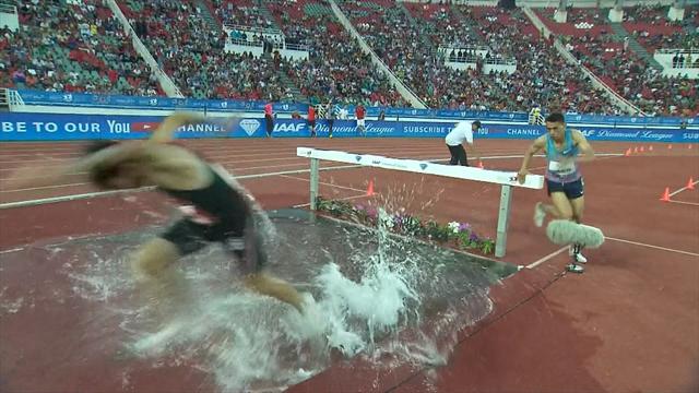 Athlete runs around barrier in 3000m steeplechase Athlete runs around barrier in 3000m steeplechase