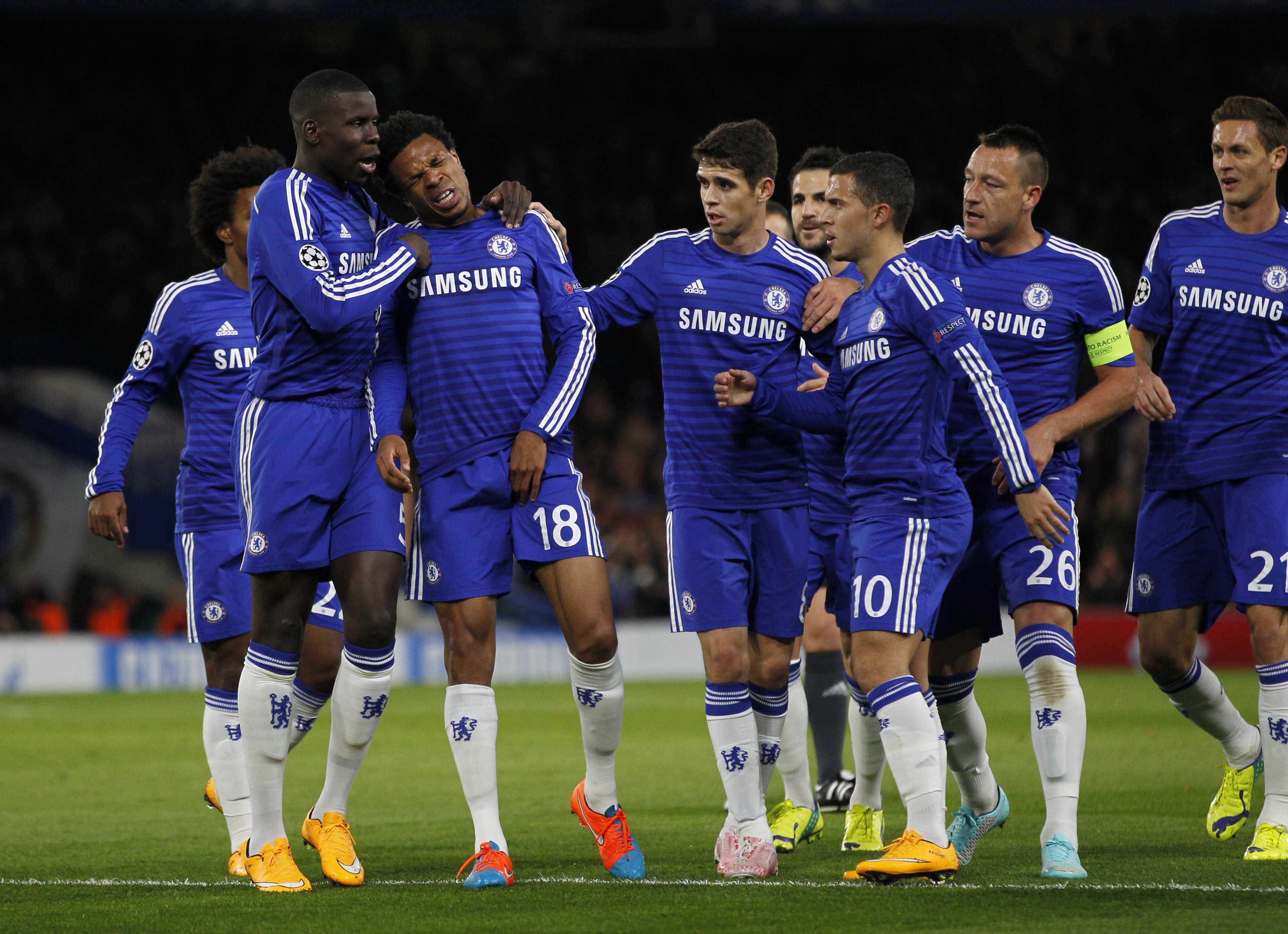 Chelseas French striker Loic Remy (3rd L) reacts as he pulls up injured after scoring the opening goal against Maribor.