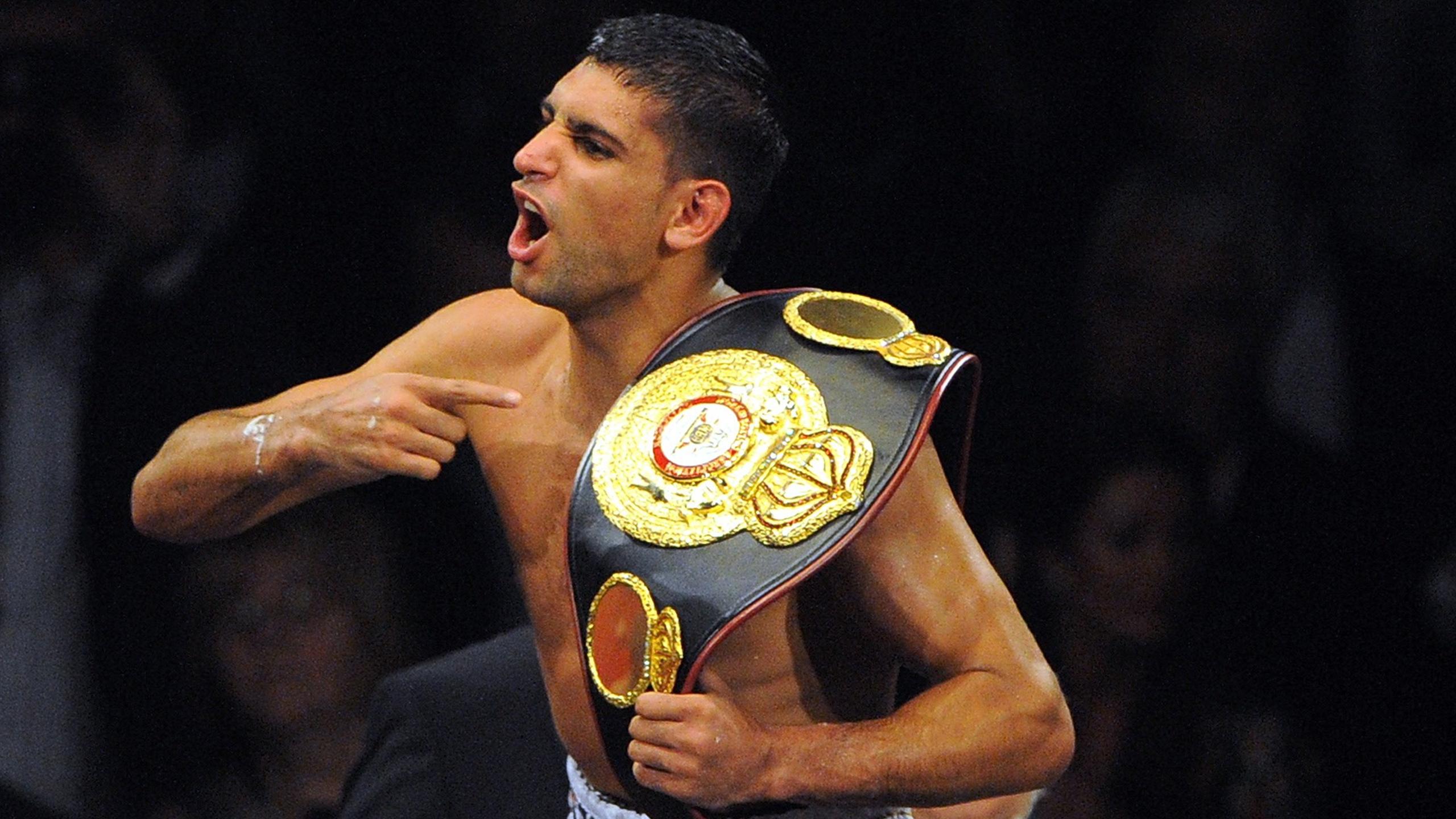 Khan defends title - Eurosport