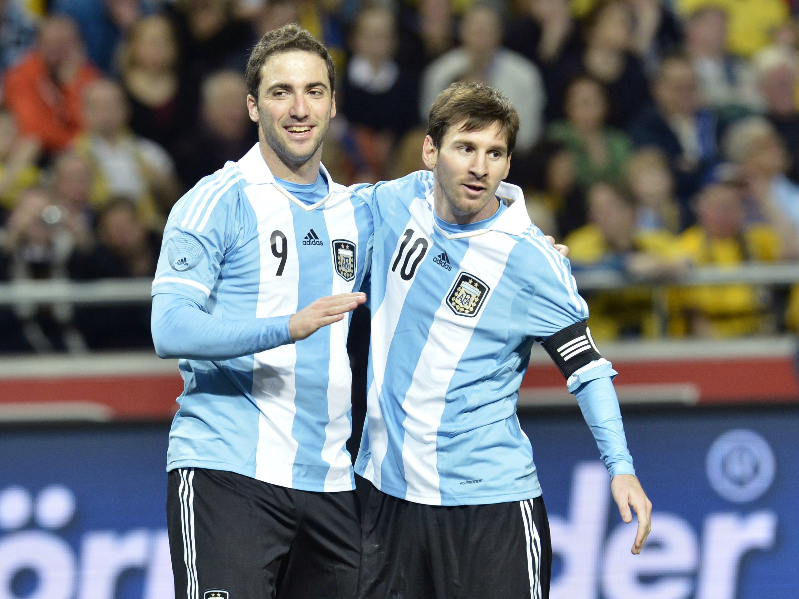 Argentina's Gonzalo Higuain (L) is congratulated by team mate Lionel Messi after a goal during an international friendly match against Sweden at Friends Arena in Stockholm, February 6, 2013 (Reuters)