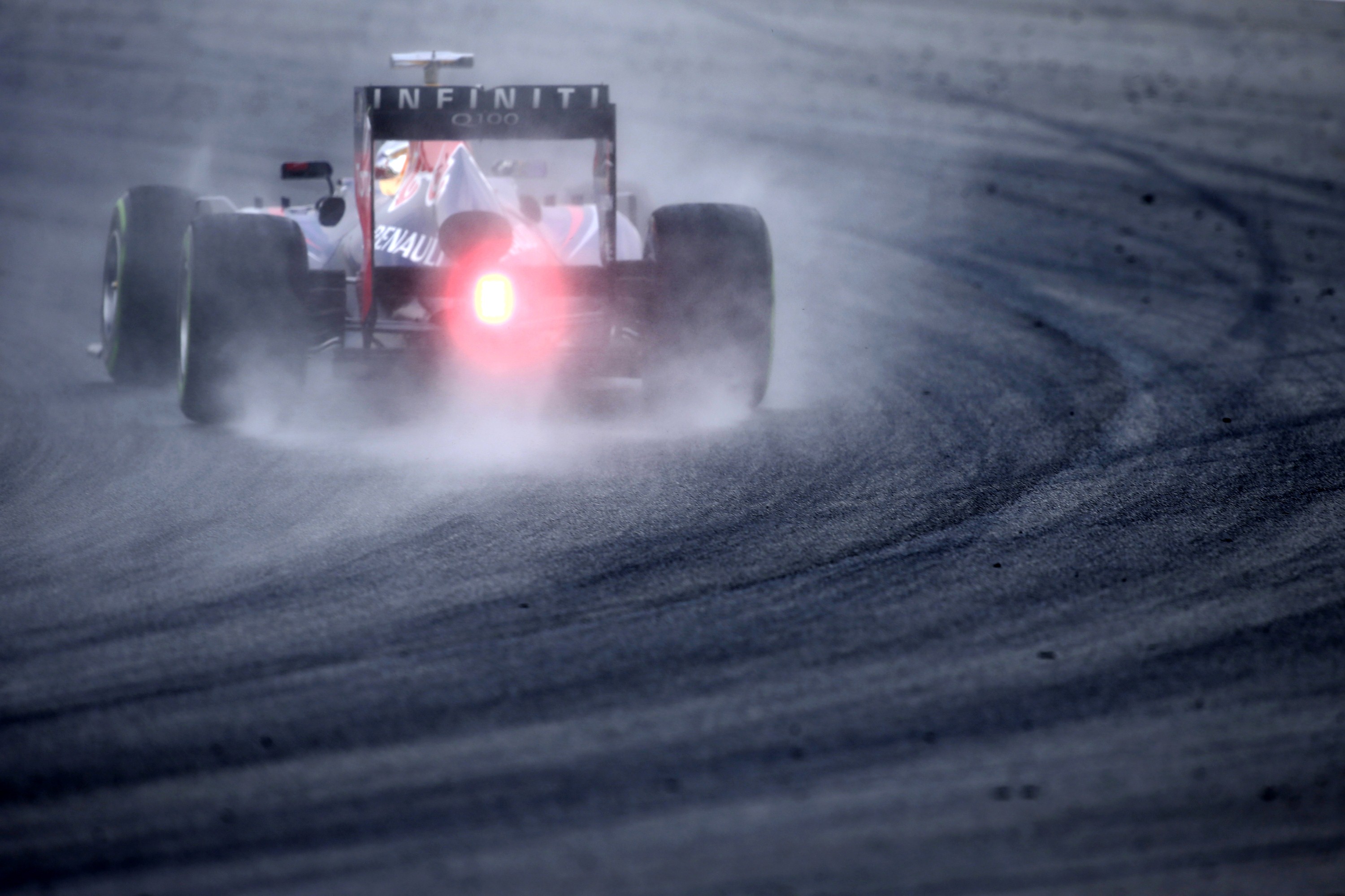 The first half of qualifying was run in the dry, but showers arrived midway through the session to force teams on to intermediate tyres. (Reuters)