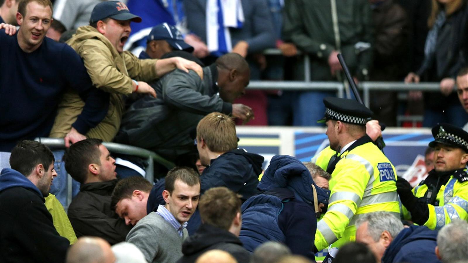 Millwall fans fight themselves in the stands during semi-final - The