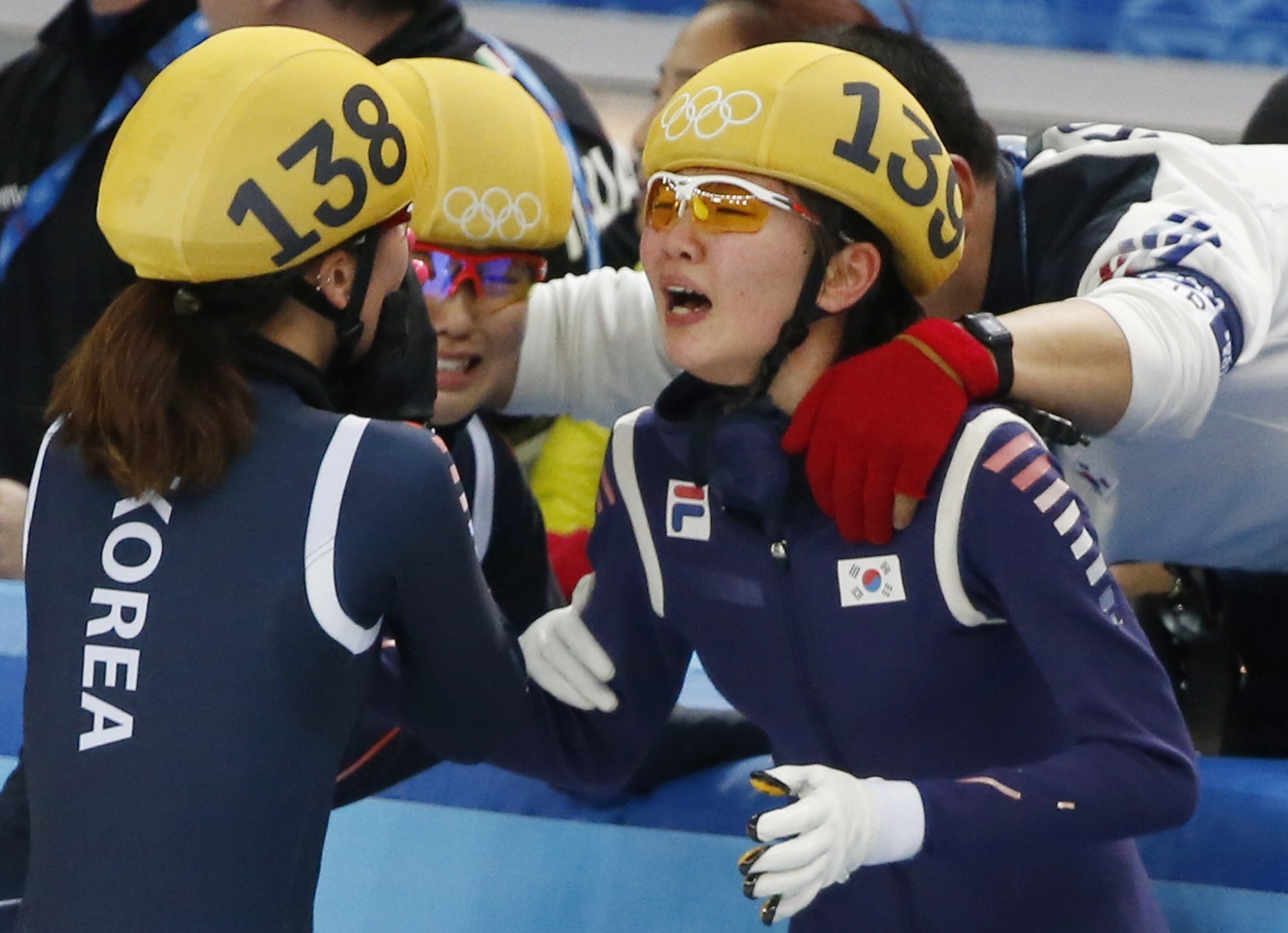 South Korea's Shim Suk Hee (R) reacts with Park Seung-Hi (L) after their team won the women's 3,000 metres relay final event at the Iceberg Skating Palace during the 2014 Sochi Winter Olympics February 18, 2014. REUTERS/Lucy Nicholson (RUSSIA - Tags: OLYM