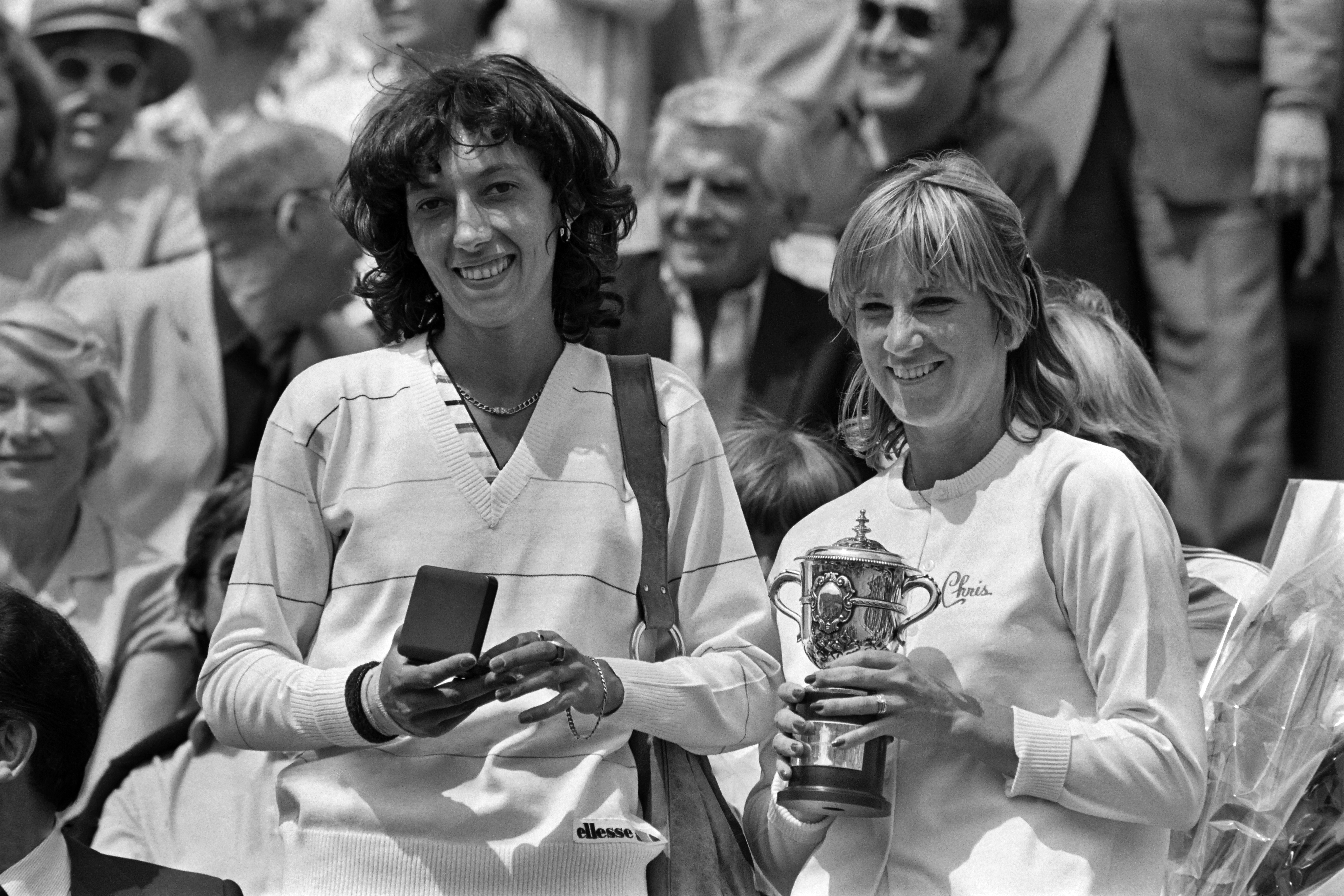 A photo taken on June 7, 1980 shows US Chris Evert-Lloyd (R) holding her trophy after she beat Romanian Virginia Ruzici (L) at Roland Garros stadium during the French tennis Open