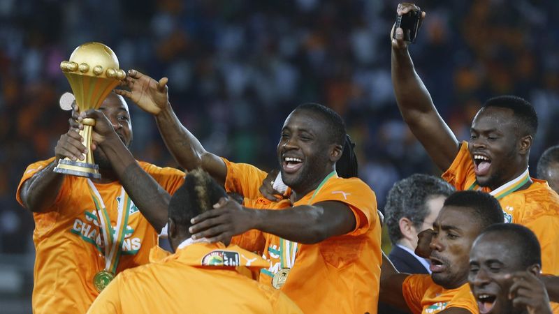 Ivory Coast's captain Yaya Toure celebrates with team mates after winning the African Nations Cup final against Ghana