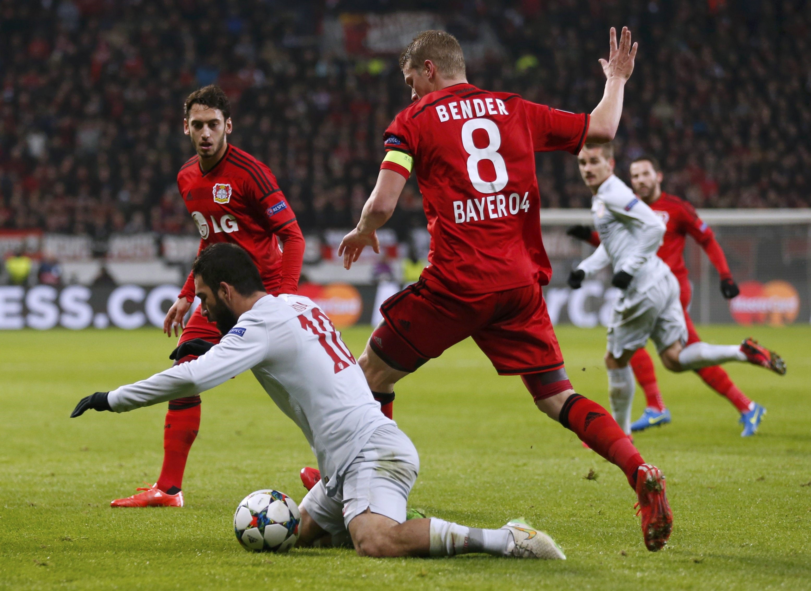 Hakan Çalhanoğlu, Sven Bender of Leverkusen and Arda Turan of Atletico Madrid