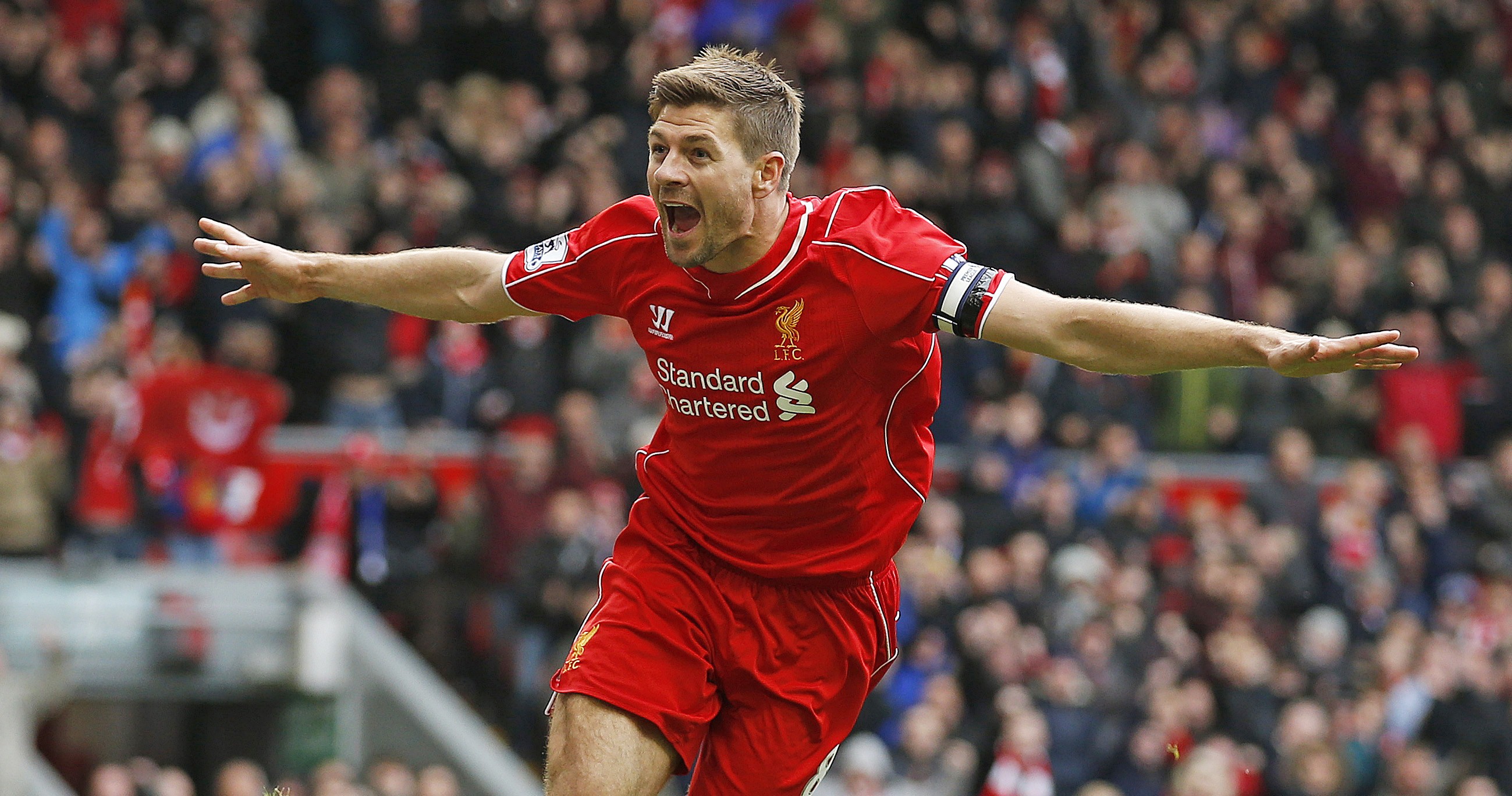 Steven Gerrard celebrates scoring Liverpool's winner against QPR