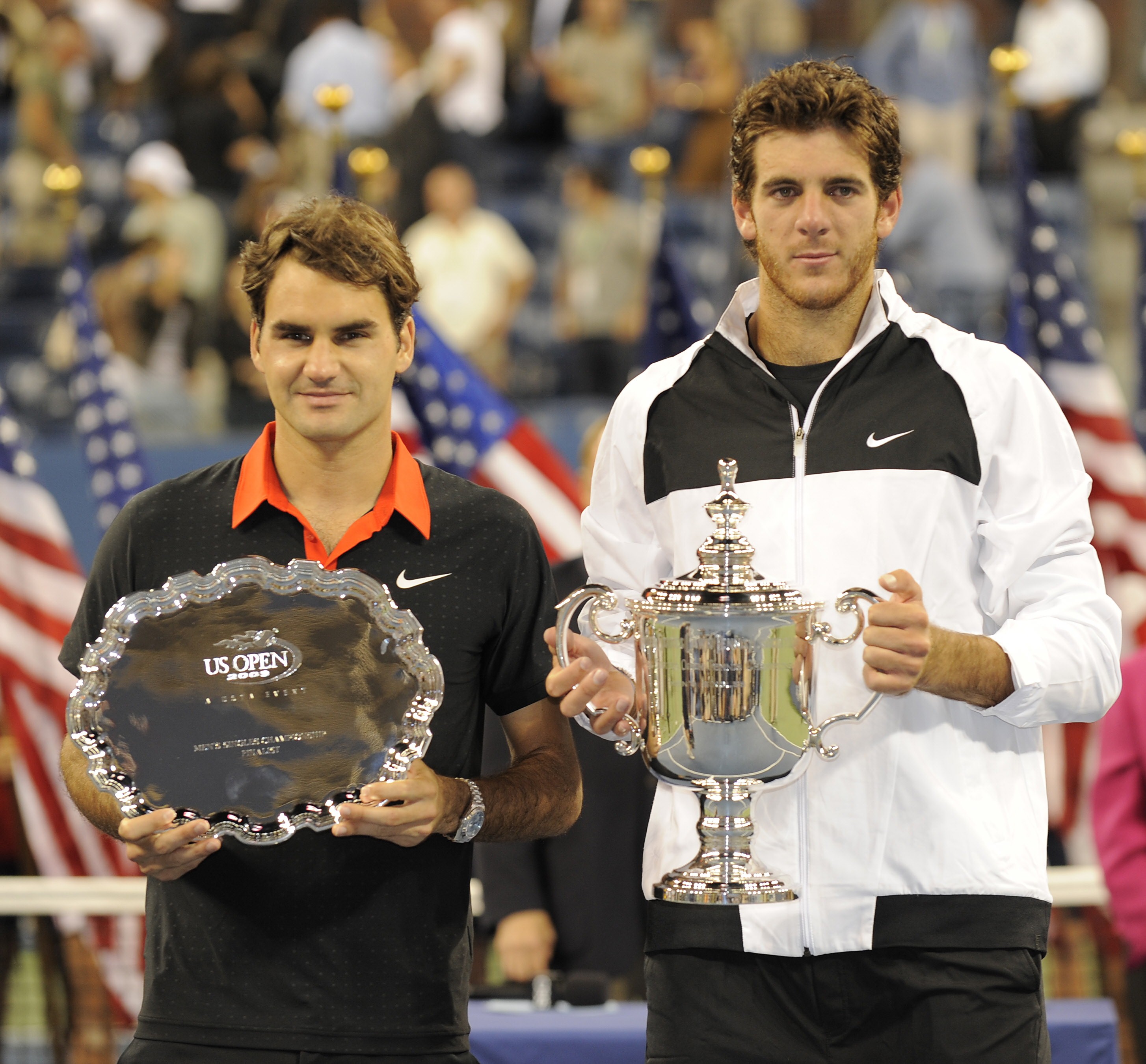 Juan Martin Del Potro (R) from Argentina stands with Roger Federer (L) from Switzerland after winning the Men's Final US Open match at the USTA Billie Jean King National Tennis Center September 14, 2009 in New York