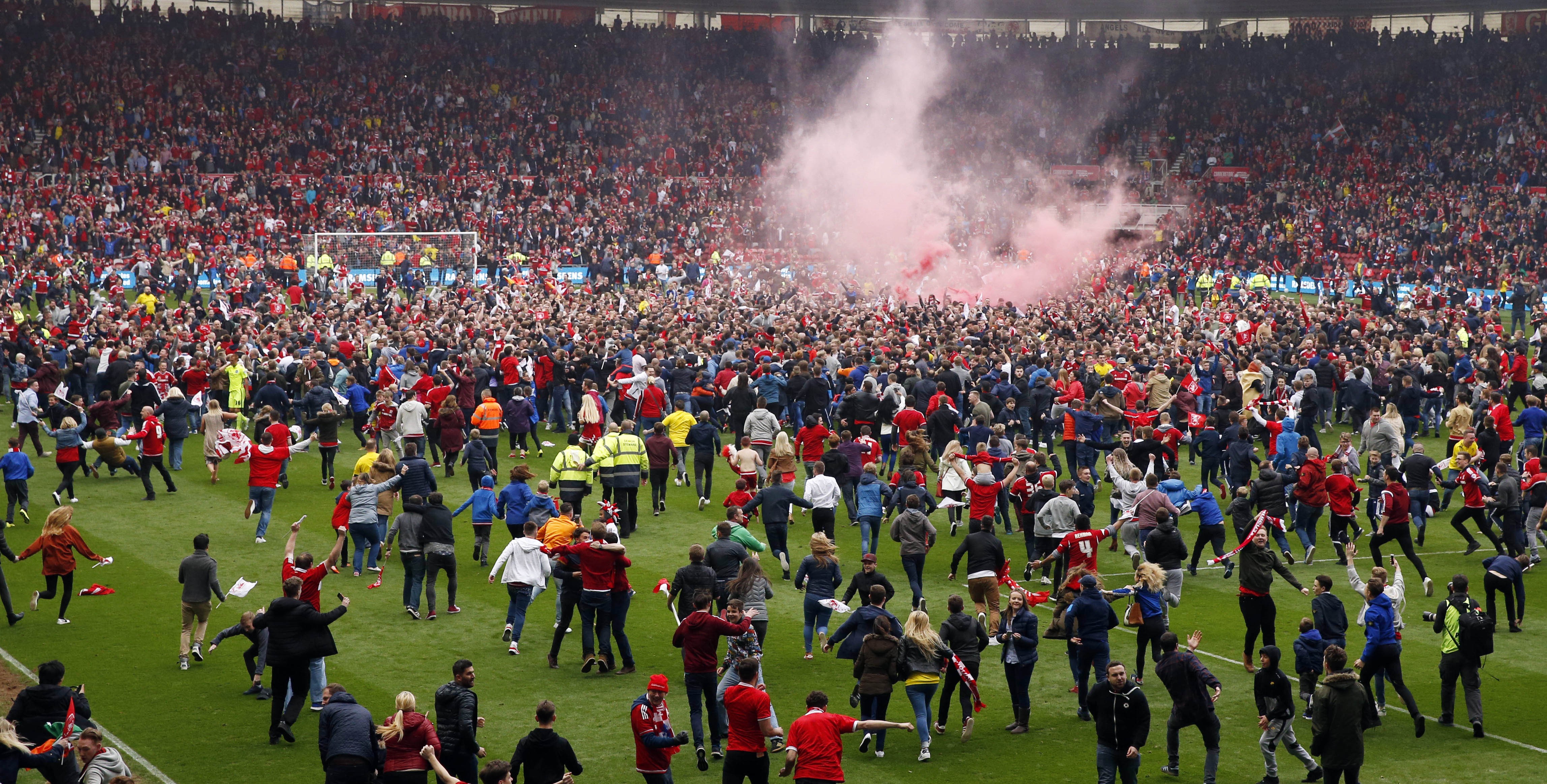 Middlesbrough fans invade pitch after securing promotion - they're back in top flight for first time since 2009