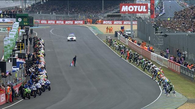 Riders sprint across track in Le Mans start Riders sprint across track in Le Mans start