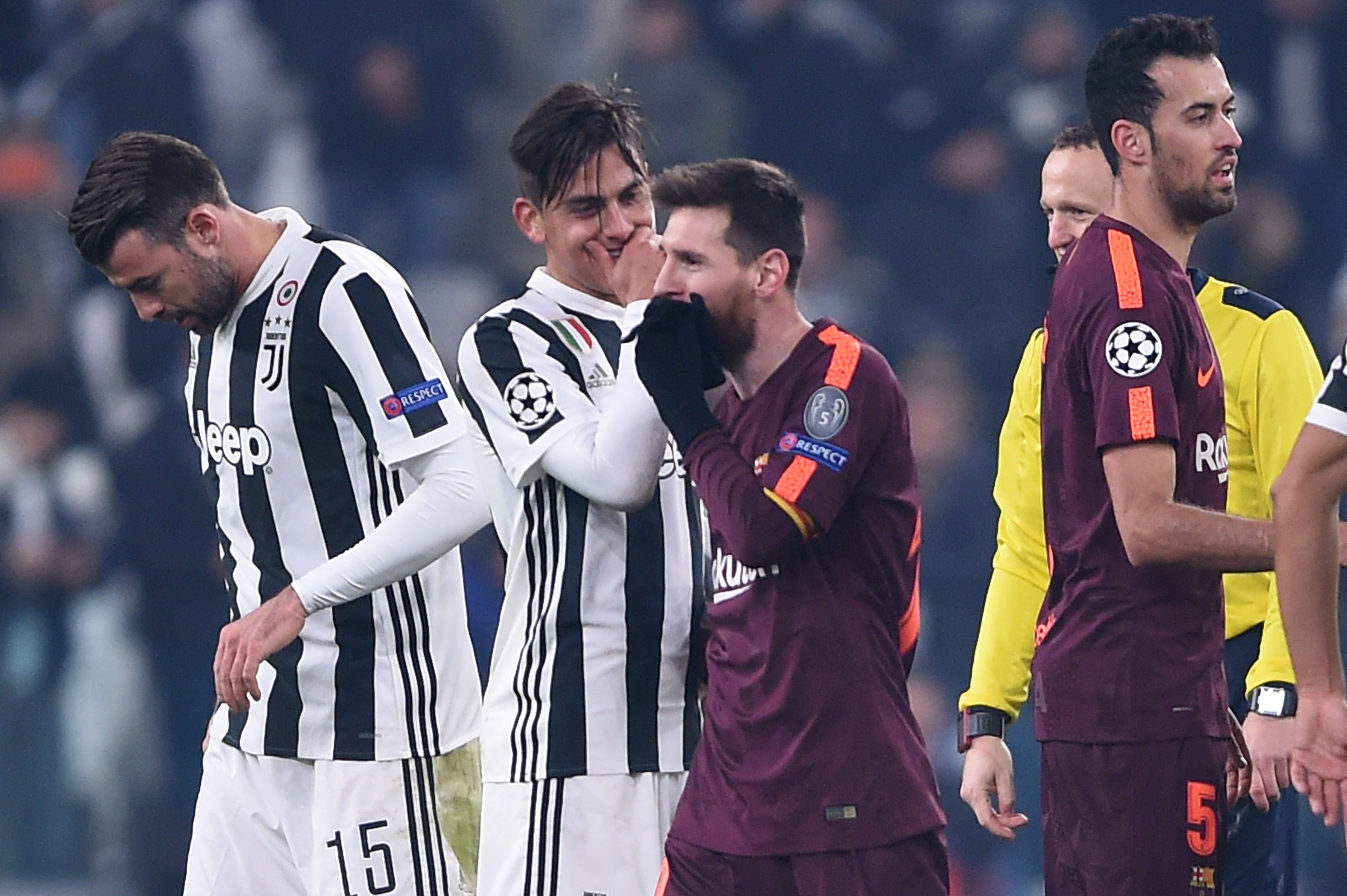 Juventus' forward from Argentina Paulo Dybala (2ndL) speaks to Barcelona's Argentinian forward Lionel Messi at the end of the UEFA Champions League Group D football match Juventus Barcelona on November 22, 2017 at the Juventus stadium in Turin. Barcelona