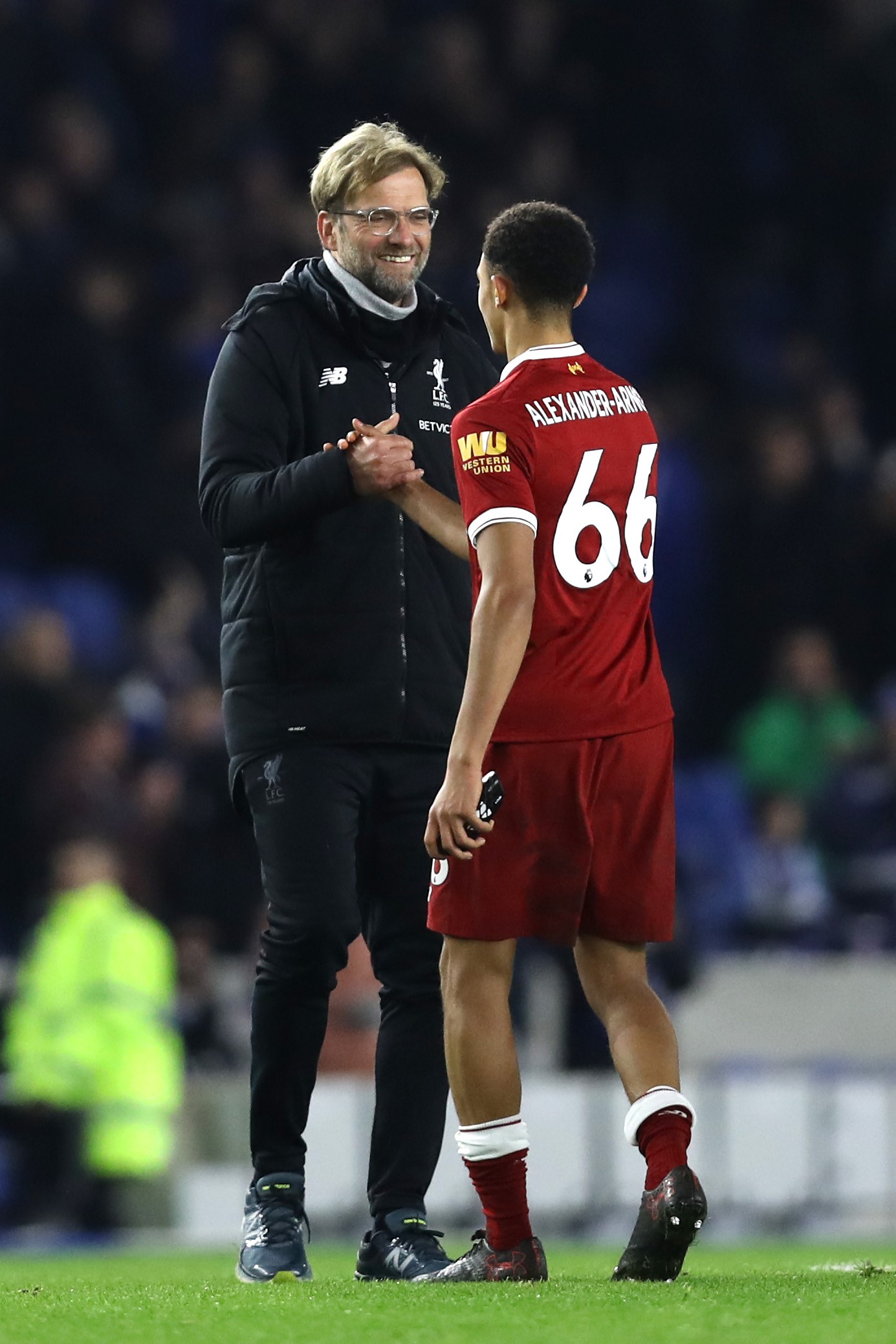 Jurgen Klopp, Manager of Liverpool and Trent Alex Arnold of Liverpool celebrate victory after the Premier League match between Brighton and Hove Albion and Liverpool at Amex Stadium on December 2, 2017 in Brighton, England.