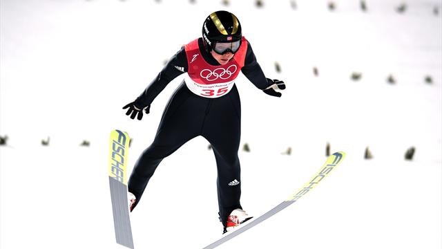 Lundby flies through blizzard to take gold