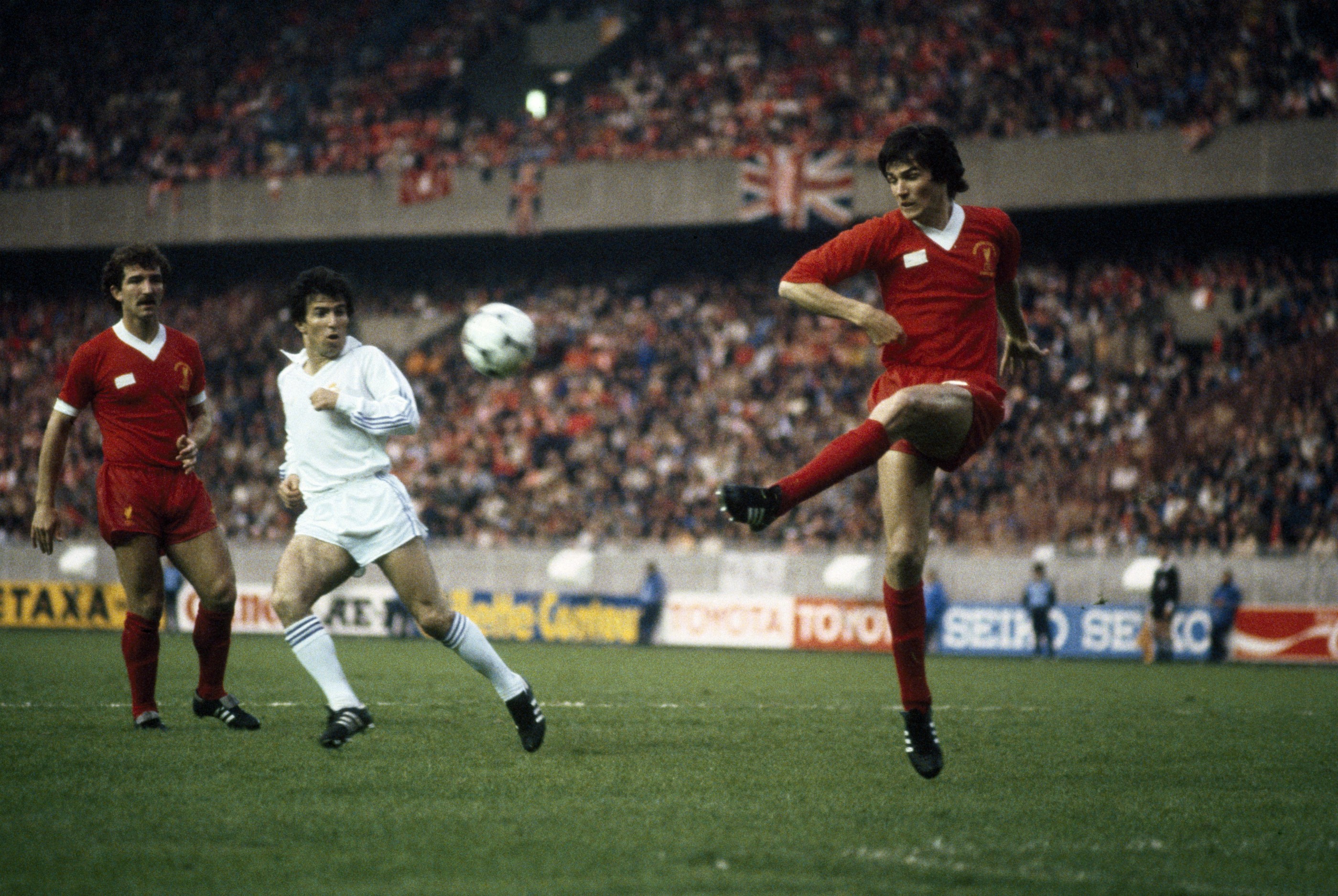 Liverpool defender Alan Hansen (right) clears the ball watched by Graeme Souness and Juantito of Real Madrid during the UEFA European Cup Final at the Parc des Princes in Paris, 27th May 1981. Liverpool won 1-0