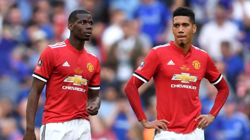 Paul Pogba (L) and Chris Smalling