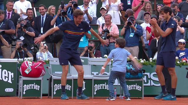 Mahut celebrates by dancing with his son Mahut celebrates by dancing with his son