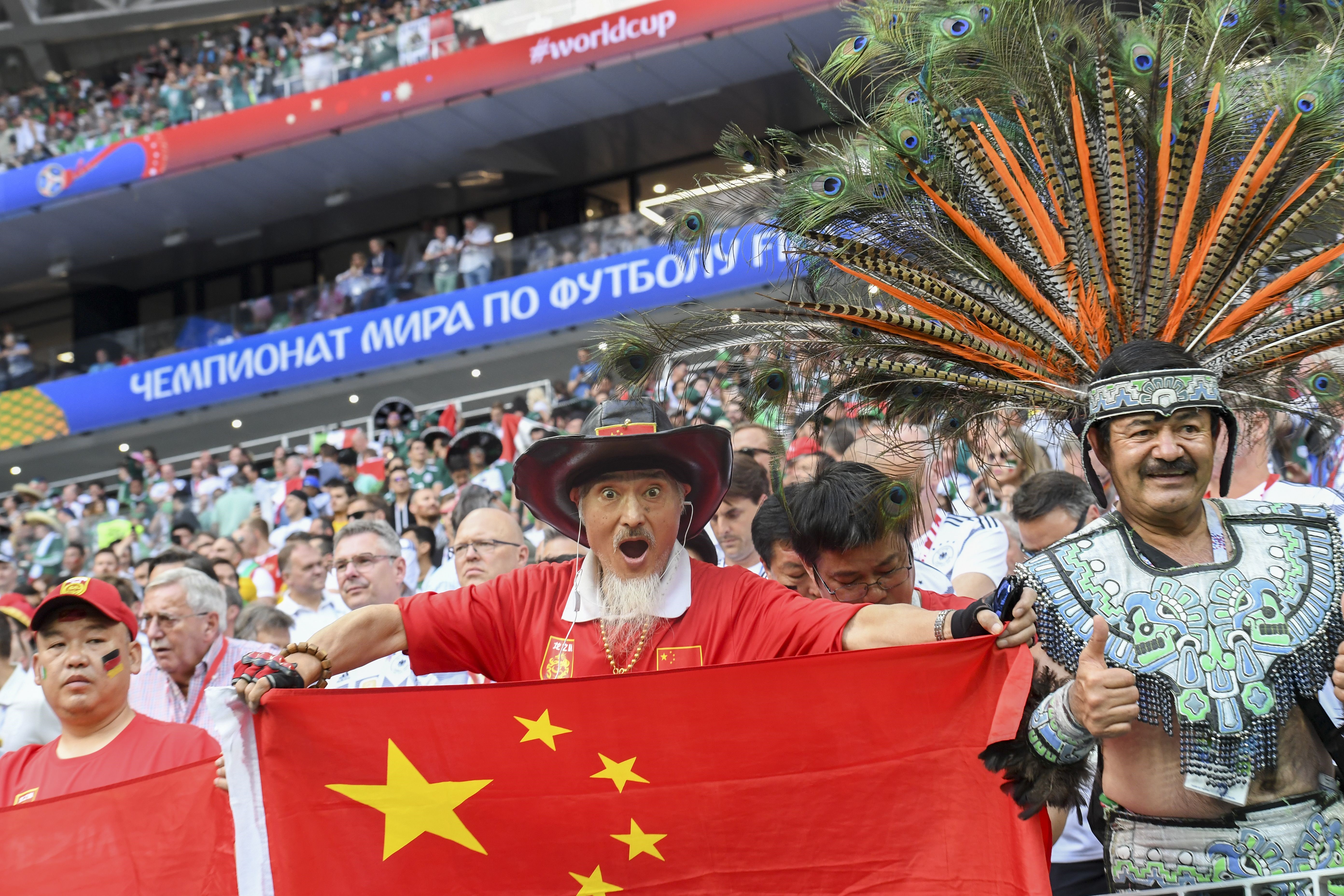 A CHinese fan cheers ahead of the Russia 2018 World Cup Group F football match between Germany and Mexico at the Luzhniki Stadium in Moscow on June 17, 2018