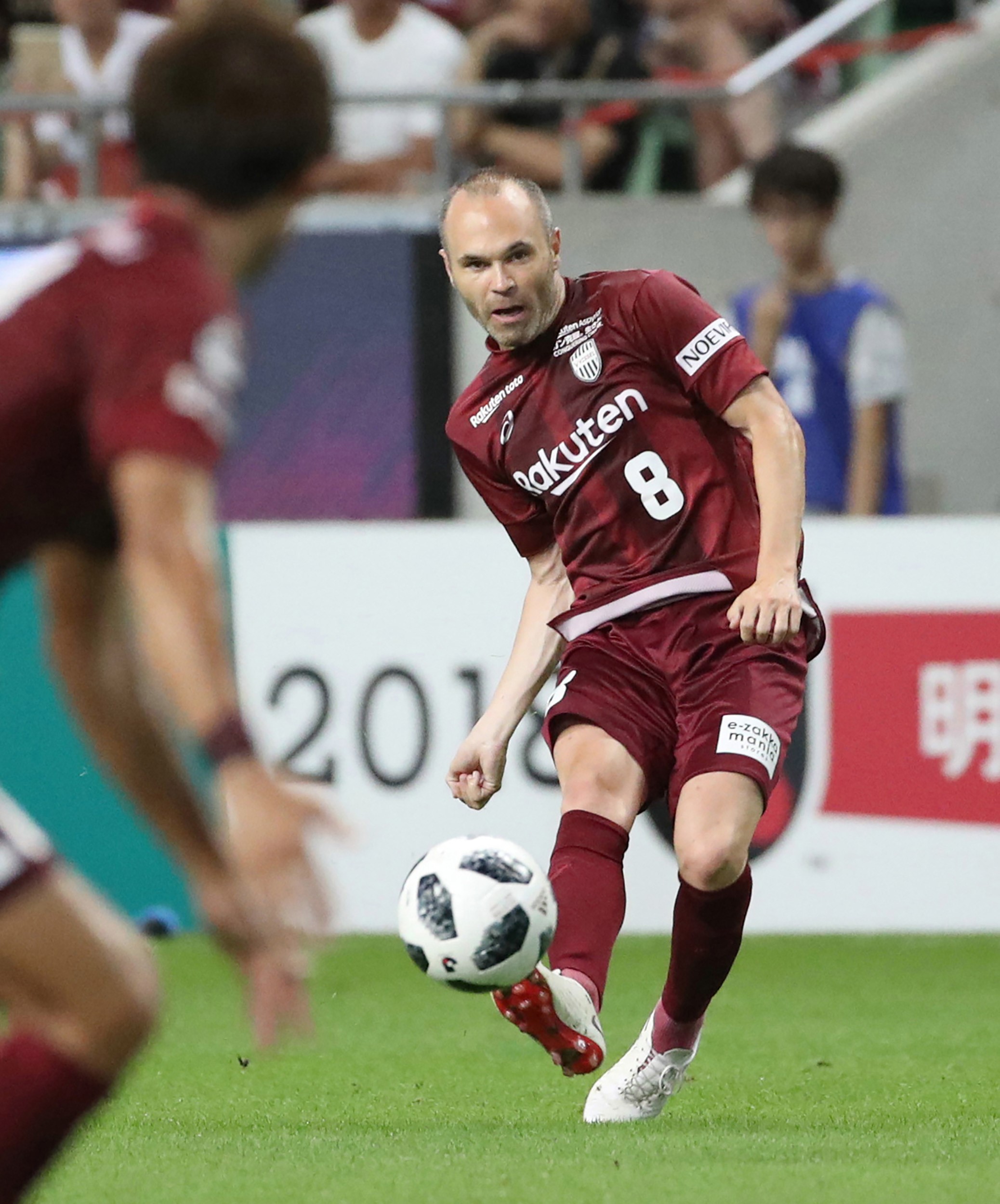 J-League club team Vissel Kobe's new signing, Spanish player Andres Iniesta (R), kicks the ball during a football match against Shonan Bellmare at Noevir Stadium in Kobe, Hyogo prefecture on July 22, 2018.