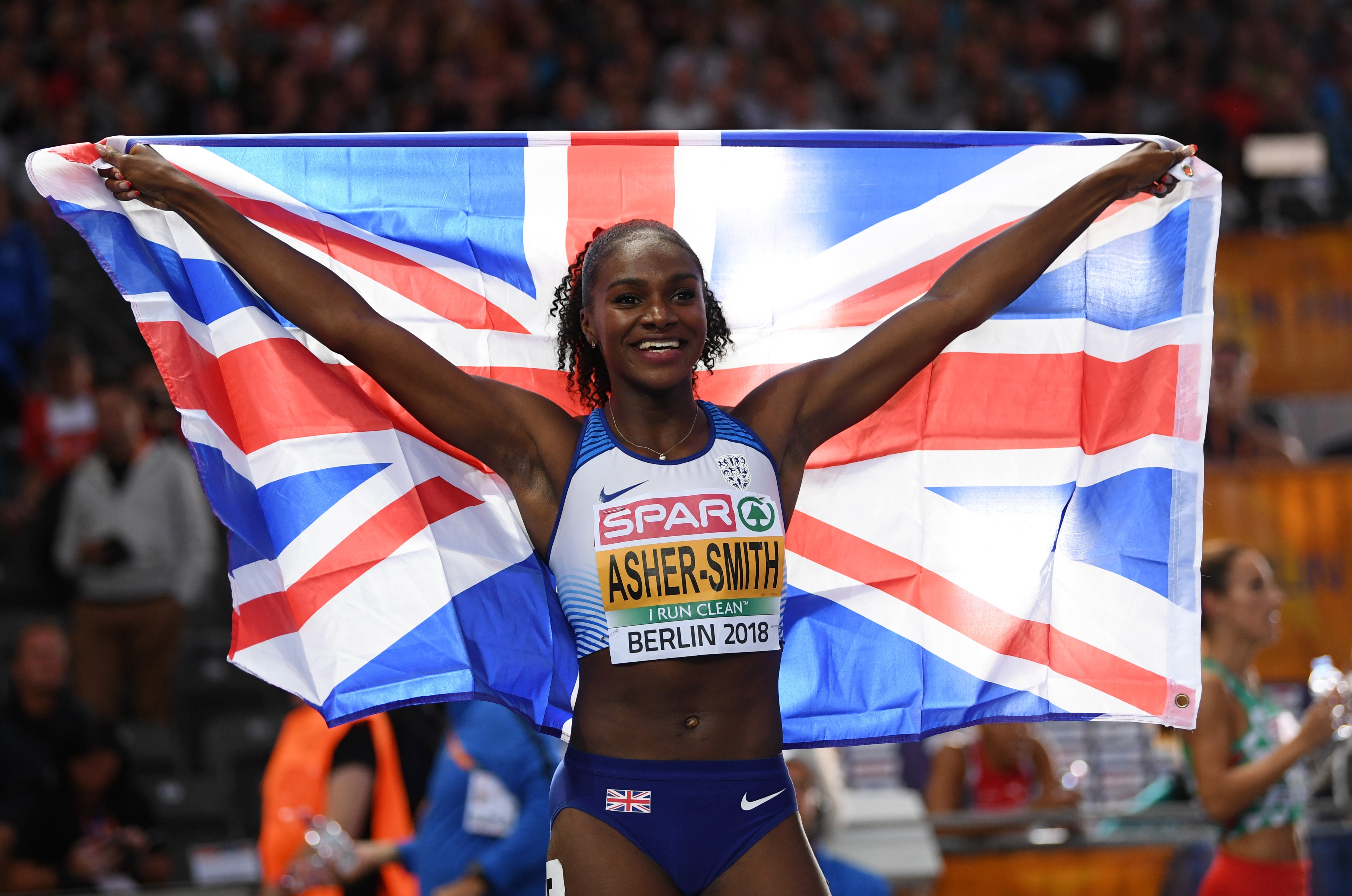 Dina Asher-Smith of Great Britain celebrates winning gold in the Women's 200 metres final during day five of the 24th European Athletics Championships at Olympiastadion on August 11, 2018 in Berlin, Germany.