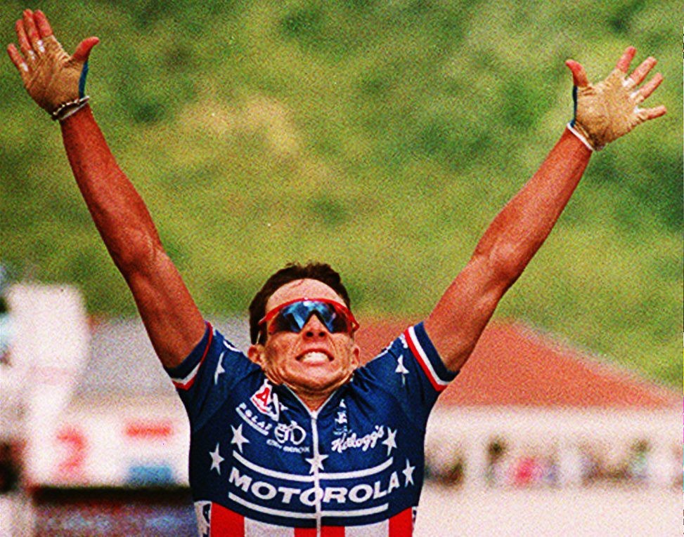 Lance Armstrong of the U.S. raises his arms after winning the eighth stage of the Tour de France 11 July 1993 in Verdun. Belgium's Johan Museeuw keeps the yellow jersey of overall leader